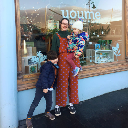 Image of Amy Orr in front of her former shop with her Son and Daughter