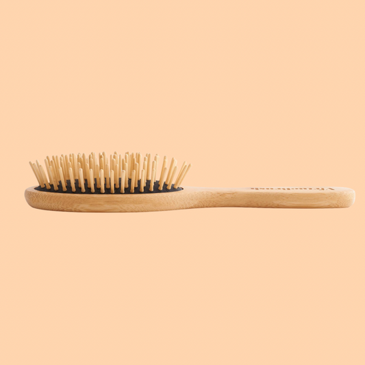 Eco-friendly brush with gentle bristles, perfect for a smooth and sustainable hair care routine.